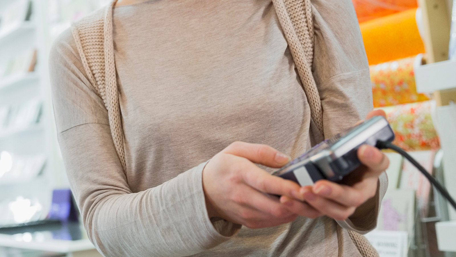 Woman entering password to verify identity.