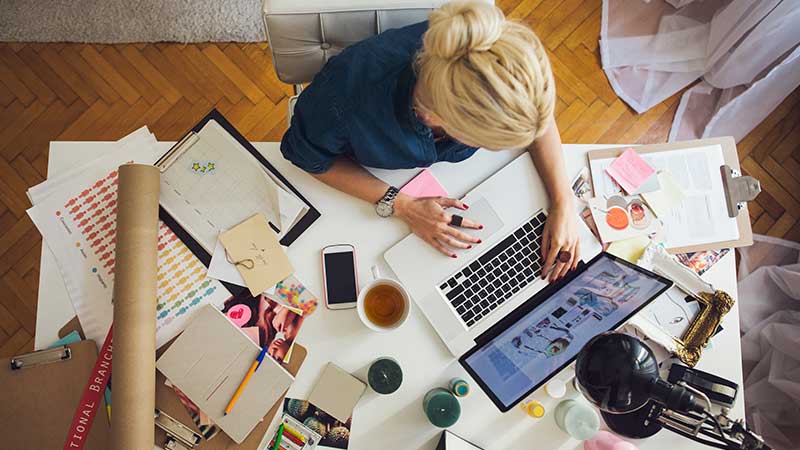 Top view of women using laptop 