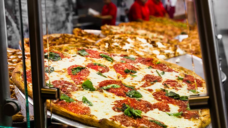 Fresh Italian pizza in New York City pizzeria window